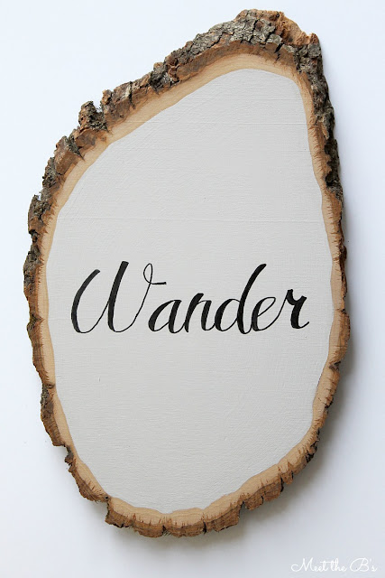 DIY wood slice wall art. "Not all who wander are lost"