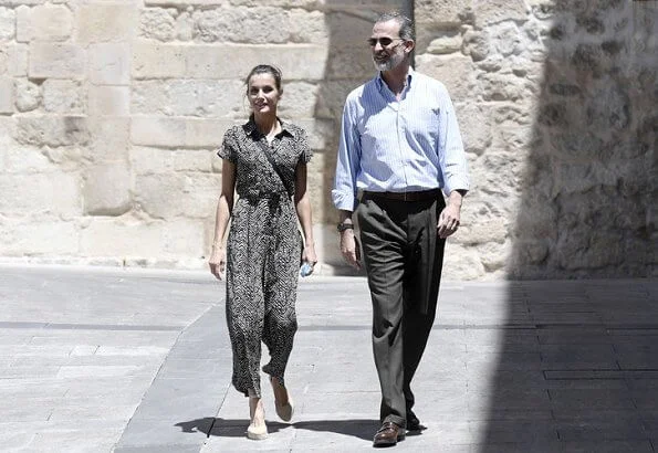 The Queen wore a new bow-detail jumpsuit by Mango. Queen Letizia wore Mango bow detail jumpsuit, gold earrings