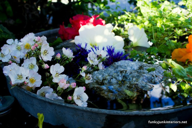 fairy garden pond in garbage can lid