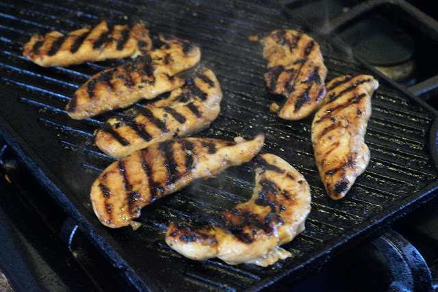 Chicken being grilled for the salad. 