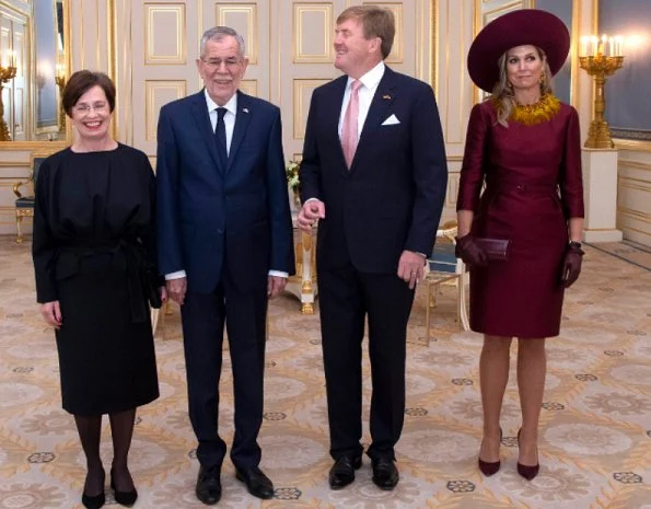 Queen Maxima's new claret red dress are from the 2018 collection of Belgian fashion house Natan. Queen wore her claret red coat by Natan