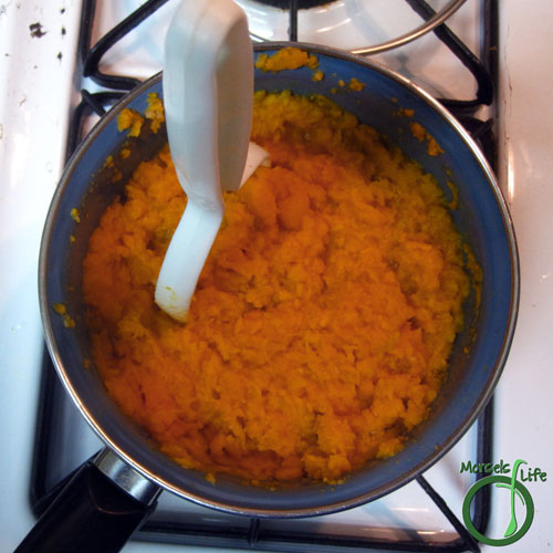 Morsels of Life - Garlic Mashed Sweet Potatoes Step 3 - Mash garlic and potatoes together. Add in bacon bits, reserving some for topping.