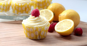lemon cupcakes with lemon buttercream and topped with a raspberry