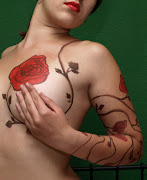Daisy tattoo designs are fun and elegant, symbolizing peace and innocence. (climbing rose vine flower tattoo design ideas)