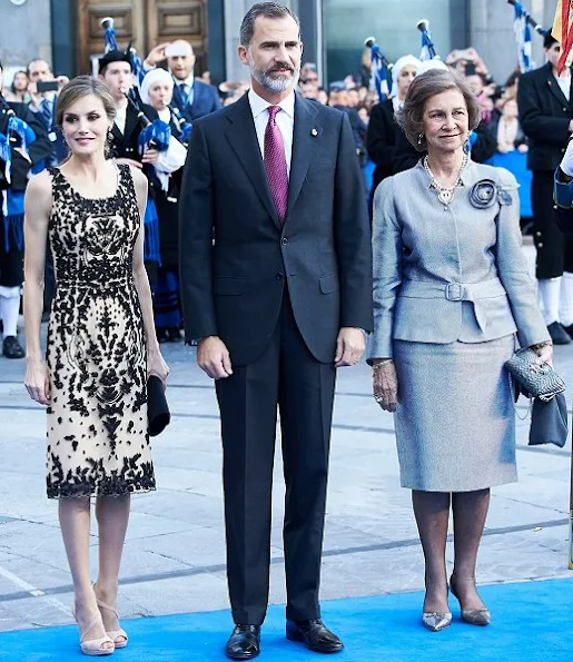 King Felipe, Queen Letizia and Queen Sofia attended ceremony of the Princess of Asturias Award 2016 at Campoamor Theater in Ovedio. Letizia wore diamond earrings, Magrit sandals, Felipe Varela dress