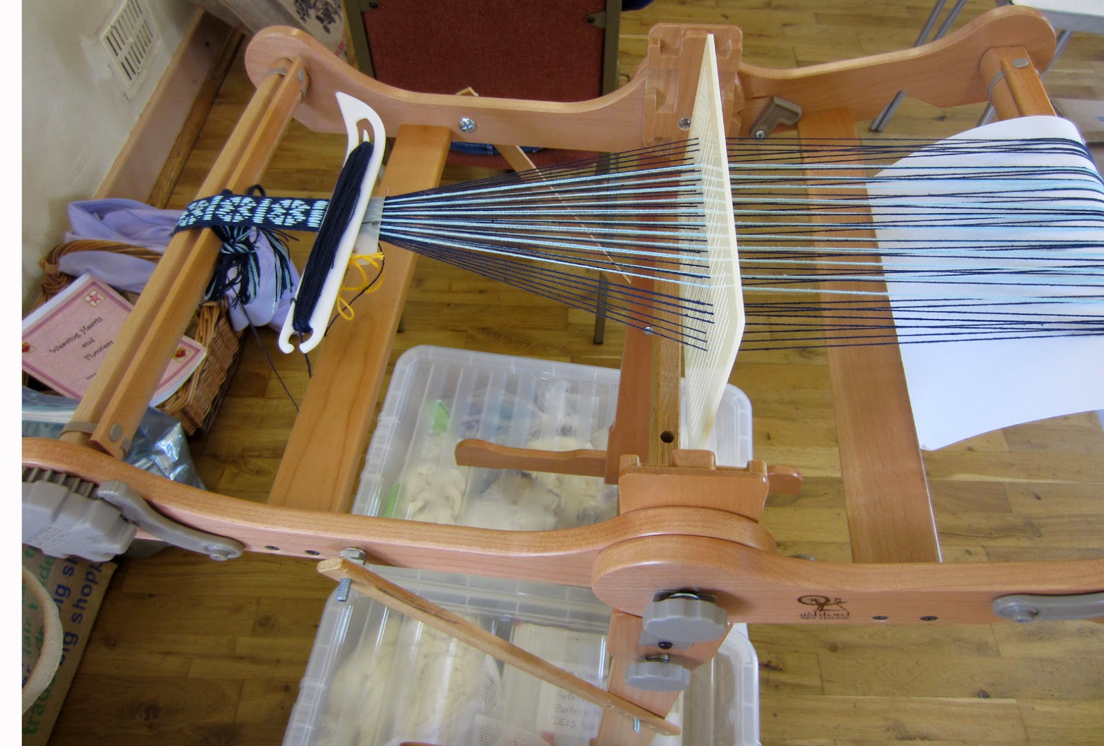 Durham Weaver weaving with a double slotted heddle.
