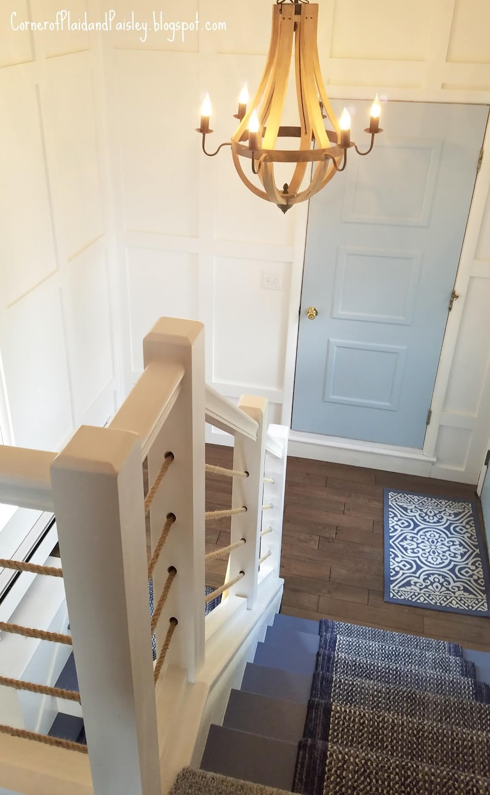 Before and After of our Lake House Stairs and Landing Corner of Plaid