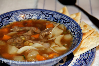 Good old fashioned vegetable beef soup, shortcut with lean sirloin in a beef and tomato base, with onion, celery, carrots, potatoes, corn and whatever leftover or frozen veggies you have on hand.