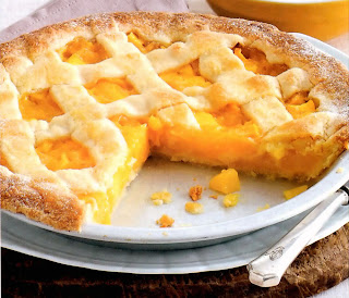 Mango and almond tart with crisscross pastry in a flan tin