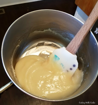 roux for ermine frosting in saucepan sauce pan full of thick milk, sugar and flour paste for ermine frosting