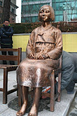A small "Korean" girl statue <br>sitting quietly in front of "Japanese" embassy in Seoul