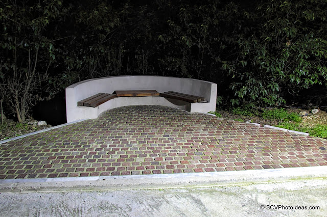 NIghtfall in the park - stone bench