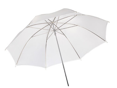 A white / translucent umbrella used for photography A white / translucent umbrella used for photography