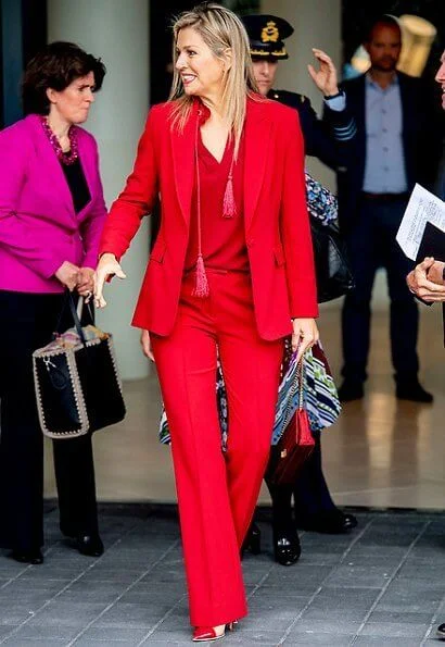 Queen Maxima wore Claes Iversen LaPerm classic blazer and Lykoi trousers and Korat silk blouse. she carries Chanel red bag