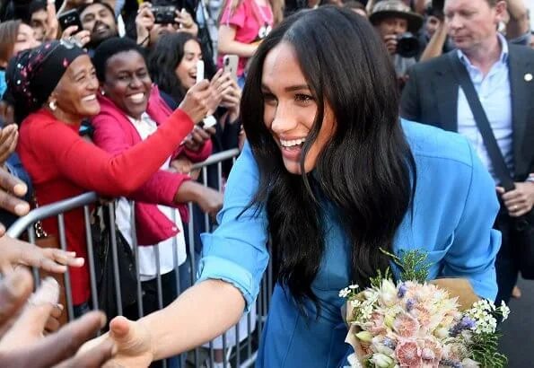 Meghan Markle wore Veronica Beard Sky Blue Cara dress. Duchess is in the same dress she wore on tour in Tonga