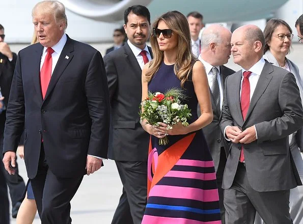  First lady Melania Trump wore a midi decoupage dress by Delpozo. for the Hamburg G20 economic summit in Hamburg, Germany