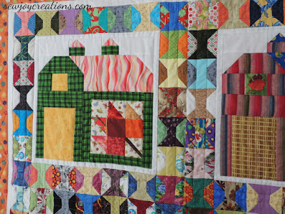 closeup of quilting on spools in quilty barn quilt