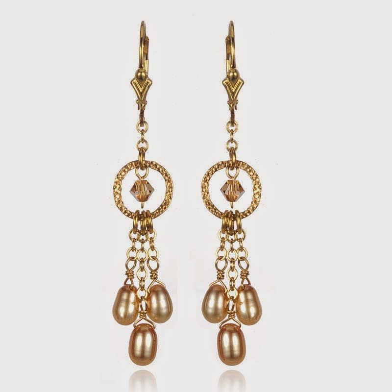 http://artisandesigngallery.com/jewelry/earrings/1083/creme-pearls-and-champagne-swarovski-austrian-crystal-earrings/