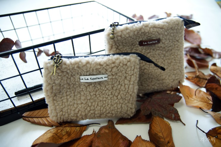 Small cosmetic pouch made of faux fur makeup bag mini wallet. Small cosmetic pouch made of faux fur makeup bag mini wallet.