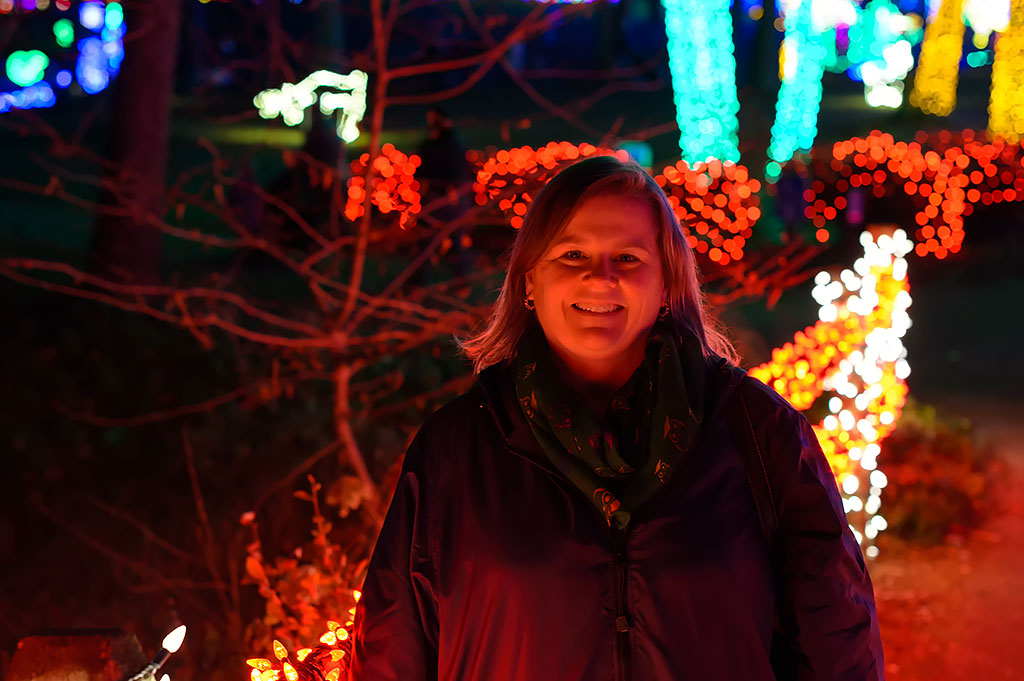 Peg stops for a photo at Winter Walk of Lights