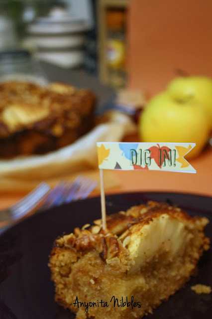 A slice of nut-crusted toffee apple cake with Thanksgiving mini flag from www.anyonita-nibbles.com