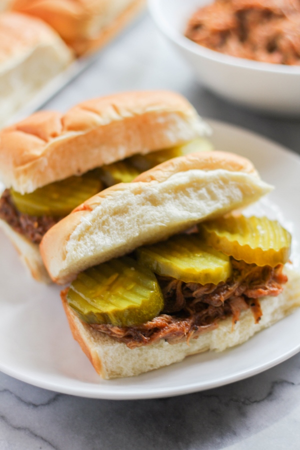 Serve up these Spicy BBQ Pepper Pork Sandwiches for a fast and delicious weeknight meal! They are hearty and flavorful, and the slow cooker does all the work!