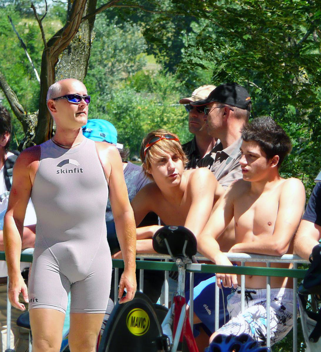 Triathletes in Grey Skinsuits and Tri Shorts.