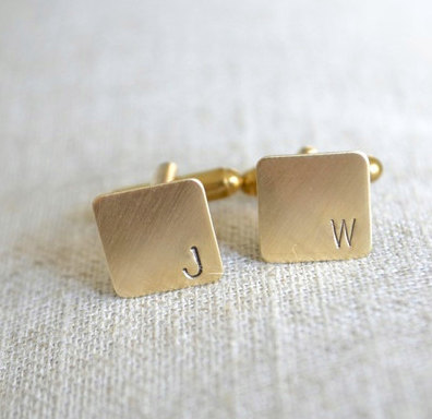 http://www.whitetrufflestudio.com/collections/stamped-metal-cufflinks/products/personalized-initial-mini-cufflinks-hand-stamped-in-brass