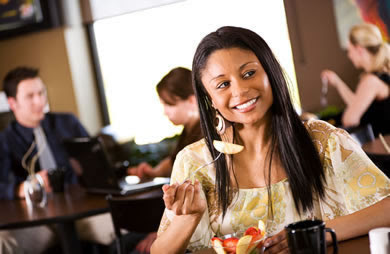 African American Woman Eating Out