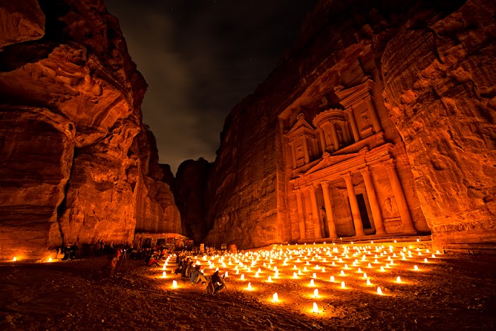 Amazingexplore Candles and moonlight illuminate Al-Khazneh, the iconic Treasury of Petra, Jordan