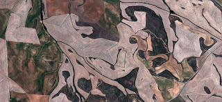 grotesques,abstract allegory,Spain fields from the air,abstract surrealism,artistic representation of human labor camps grotesques,abstract allegory,Spain fields from the air,abstract expressionist photography, abstract landscape, fantasy imaginary forms,