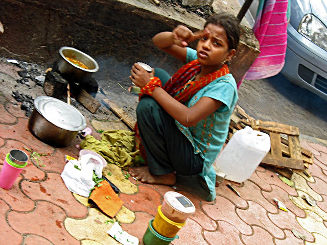 girl cooking on pavement