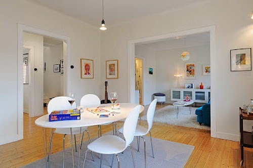 Beautiful White Room with Blue Sofa with White Dining