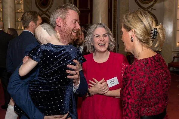 Countess of Wessex wore Azzedine Alaïa red wool blend lace flared knit dress. Conflict Wound Research at Queen Elizabeth Hospital