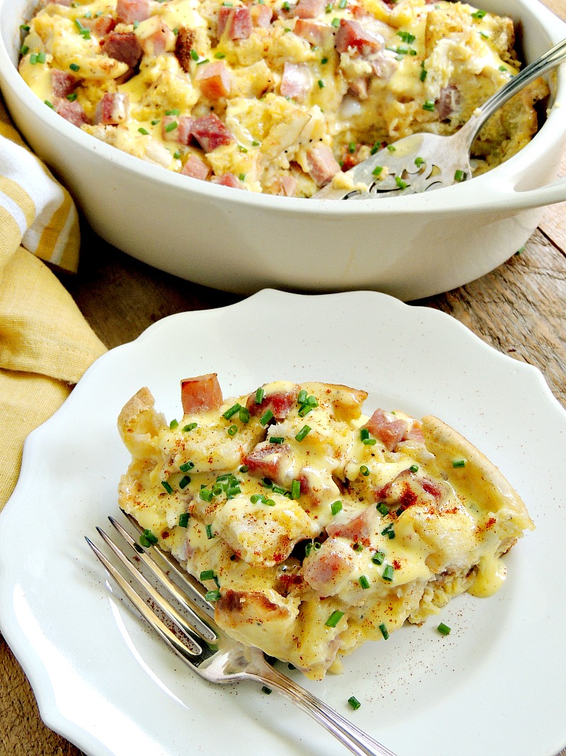 Impress your family and friends with this easy Eggs Benedict Breakfast Casserole. It is perfect for the holidays, Mother's Day, or just a fun family weekend breakfast. From www.bobbiskozykitchen.com #breakfast #eggs #casserole #easy