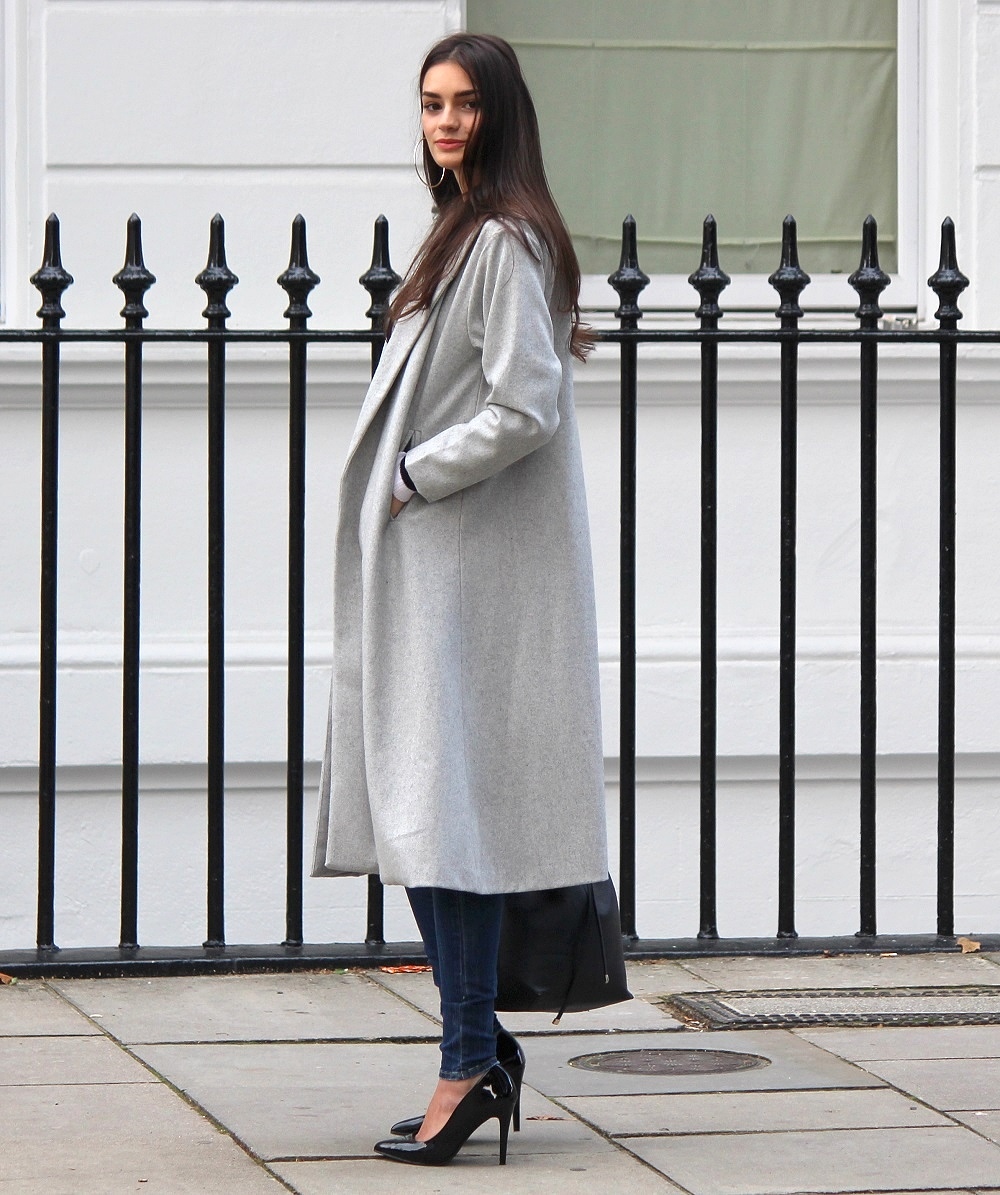 peexo fashion blogger wearing distressed denim and longline coat