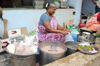 A woman selling Raagi Malt  