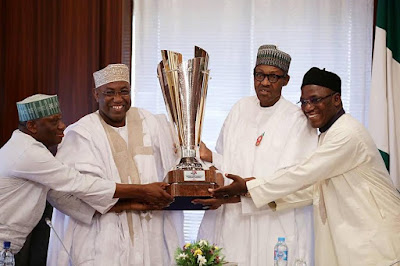 B Photos: President Buhari receives National Open Water Swimming Competition Trophy