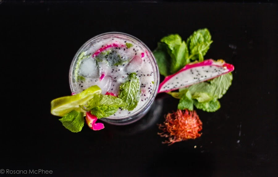 Assortment of exotic fruits including dragon fruit, rambutan, and mangosteen