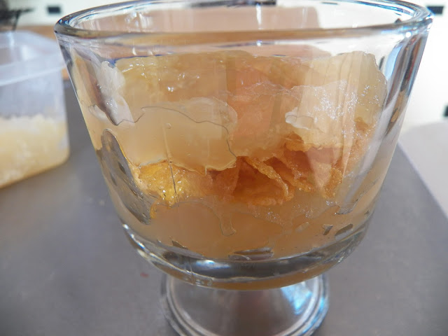 Applesauce and cornflakes layered in dish