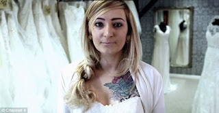Bride to-be has immense rock chick tattoo on her mid-section CUT OUT for the day of her wedding