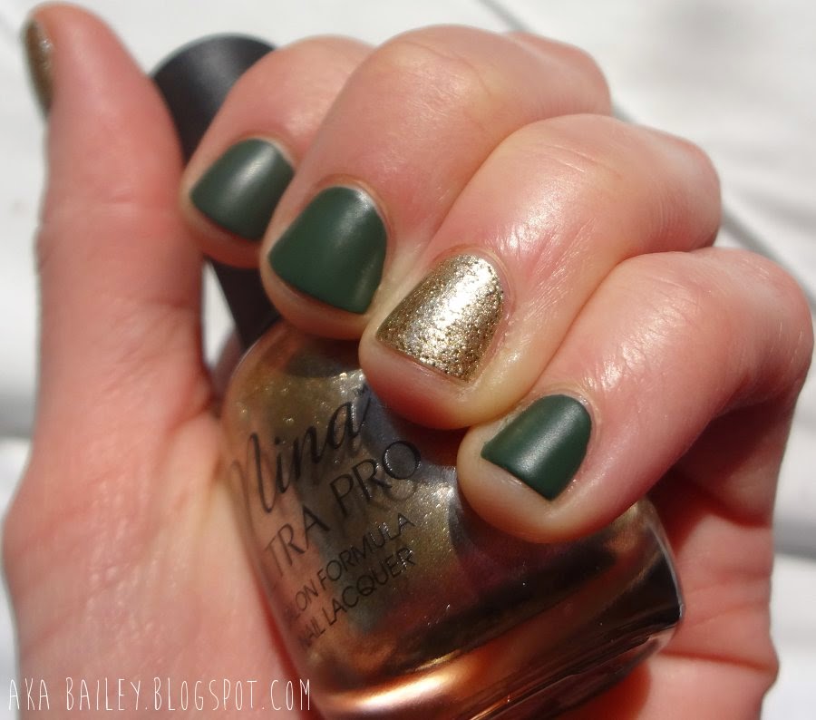 St. Patrick's Day nails: Gold glitter accent nails with matte emerald green nails