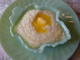 grits and butter in a blue bowl