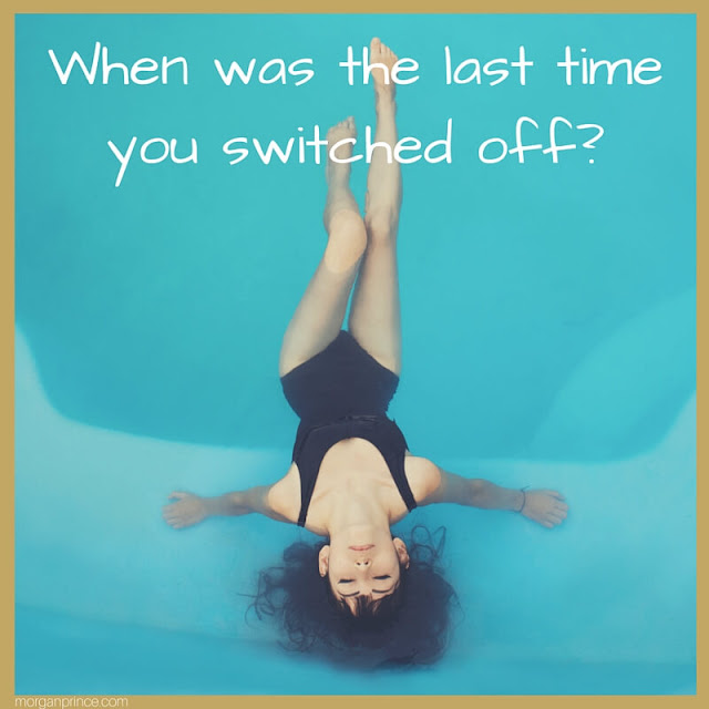 Lady in a swimming pool, relaxing. When was the last time you switched off?
