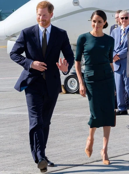 Meghan Markle wore Givenchy patch pocket pencil skirt, and Vanessa Tugendhaft Charm earrings, carried Strathberry handbag