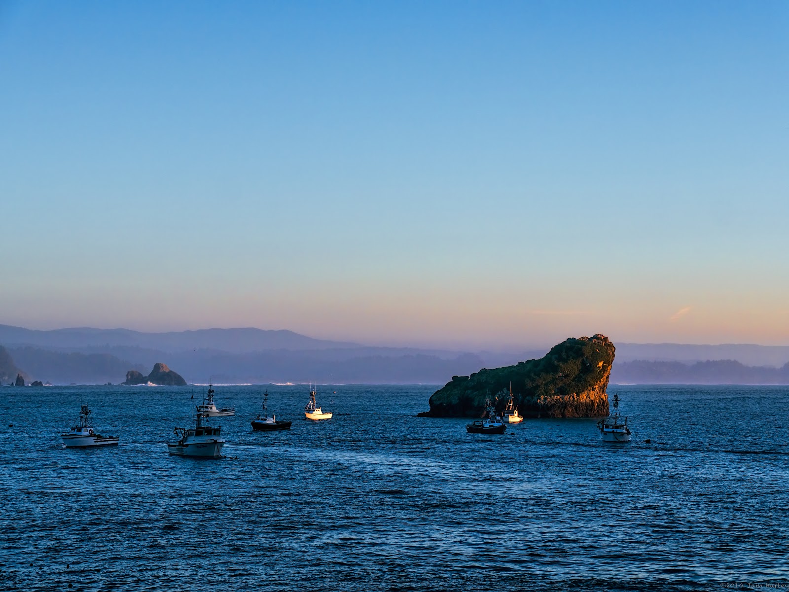 Guardian of the Fleet Large rock protecting fishing fleet