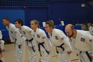 Adult Karate Classes Adult martial artists doing a bow in an adult karate class