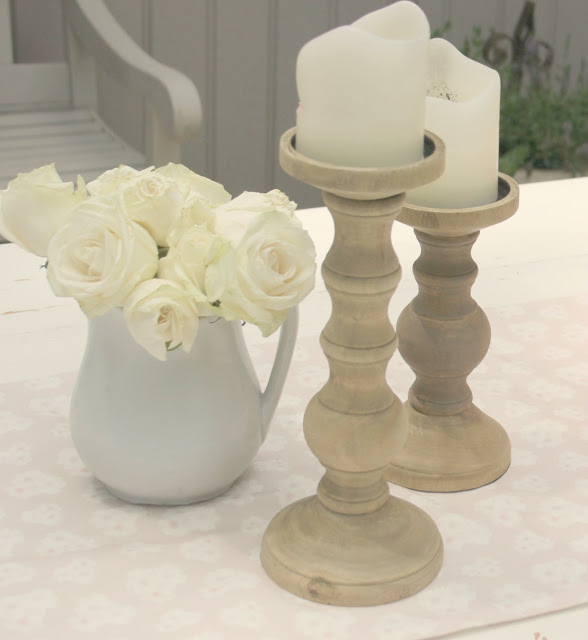 White ironstone pitcher with white roses and wood candlesticks - Hello Lovely Studio