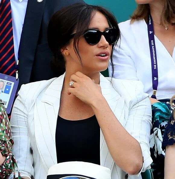 Meghan Markle wore L'Agence Brea pinstriped-linen and cotton blend blazer. The Duchess of Sussex and Serena Williams