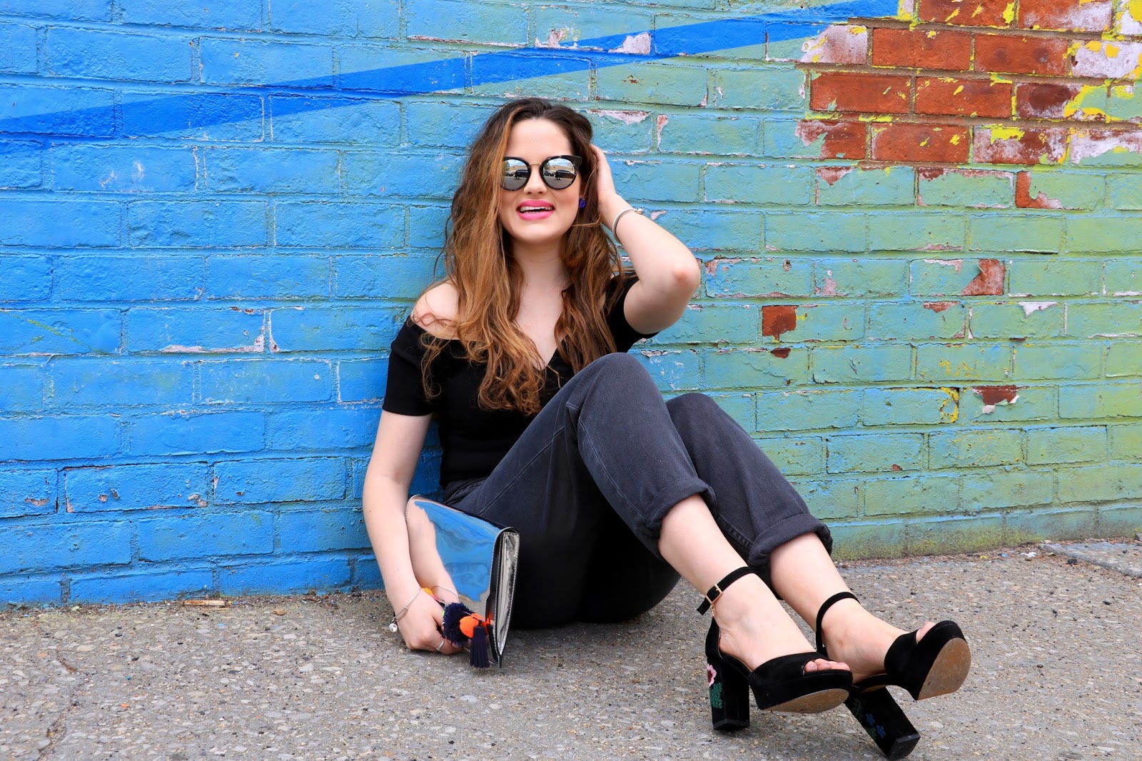 NYC fashion blogger Kathleen Harper in front of rainbow wall in Brooklyn